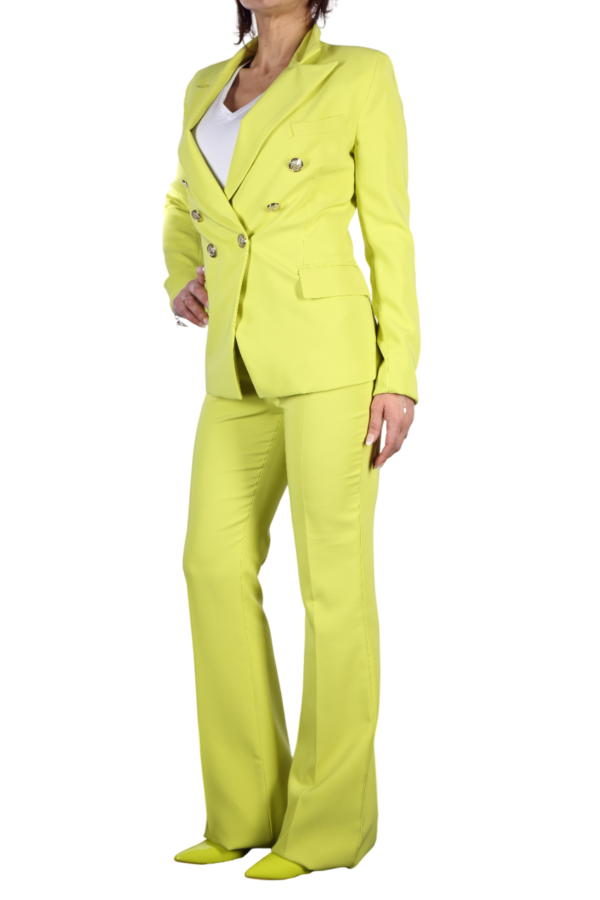 Tailleur donna giallo acido Tailleur donna giallo acido. Vista laterale